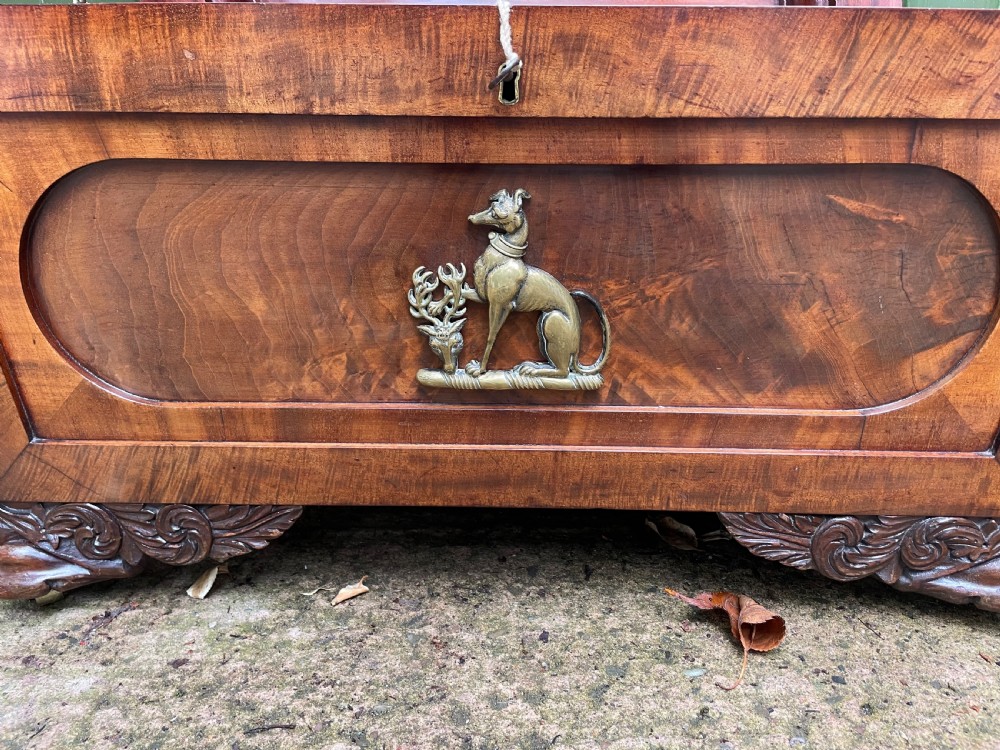 Early C19th Regency period brass-mounted mahogany cellarette or wine-cooler of classical sarcophagus form with a noble armorial . View IX