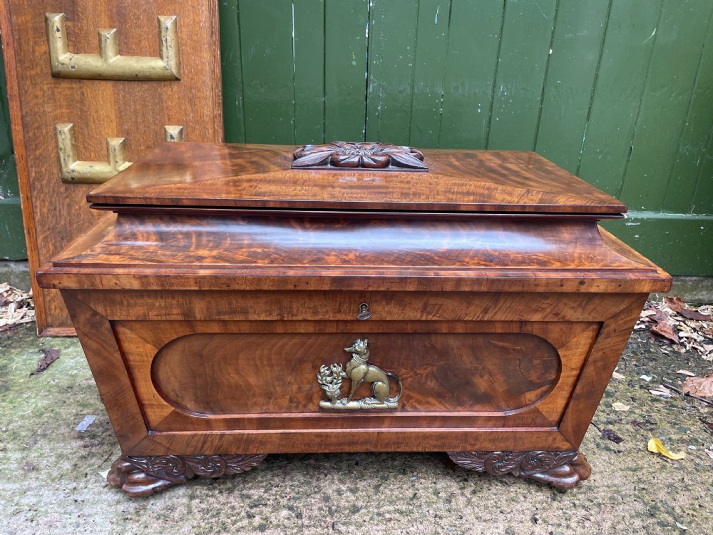 Early C19th Regency period brass-mounted mahogany cellarette or wine-cooler of classical sarcophagus form with a noble armorial . View XI
