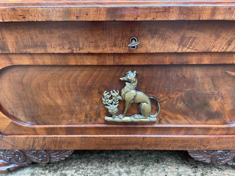 Early C19th Regency period brass-mounted mahogany cellarette or wine-cooler of classical sarcophagus form with a noble armorial . View XIII
