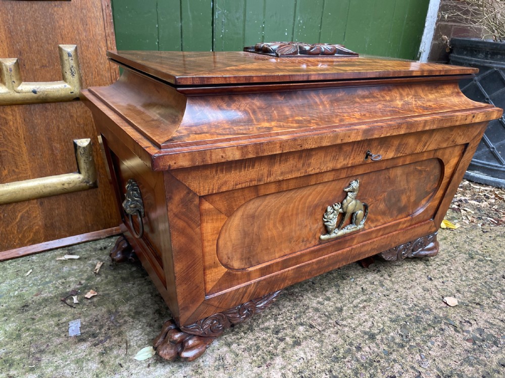 Early C19th Regency period brass-mounted mahogany cellarette or wine-cooler of classical sarcophagus form with a noble armorial . View XV