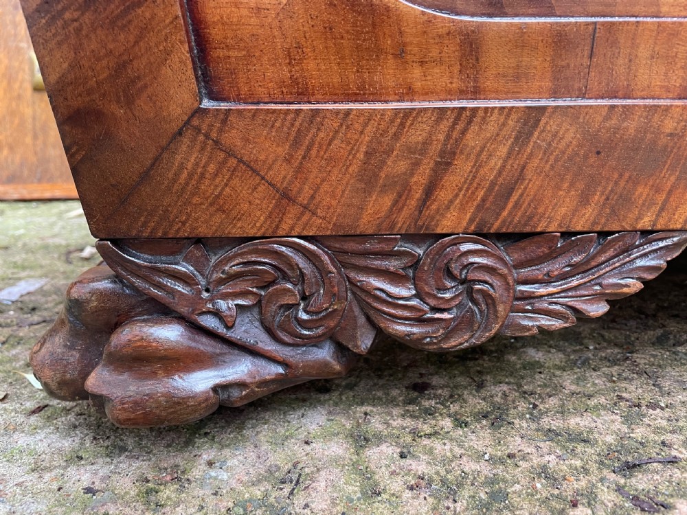Early C19th Regency period brass-mounted mahogany cellarette or wine-cooler of classical sarcophagus form with a noble armorial . View XVI