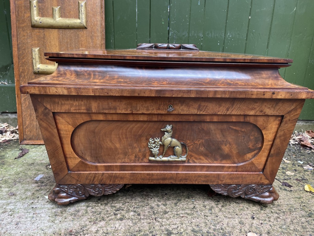 Early C19th Regency period brass-mounted mahogany cellarette or wine-cooler of classical sarcophagus form with a noble armorial .
