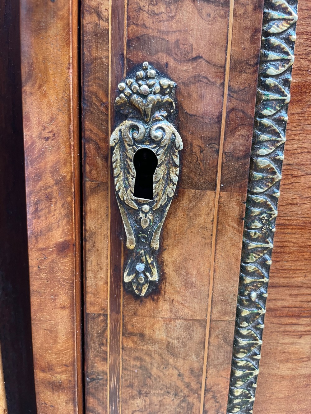 Fine quality mid C19th ormolu-mounted burr walnut bow-ended credenza. View XXI