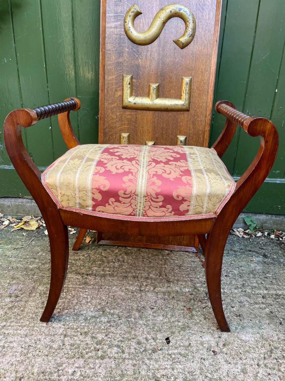 Set of four early nineteenth-century mahogany dressing stools with raised spiral-turned handles, swept legs, and red and gold patterned damask seats. View XII