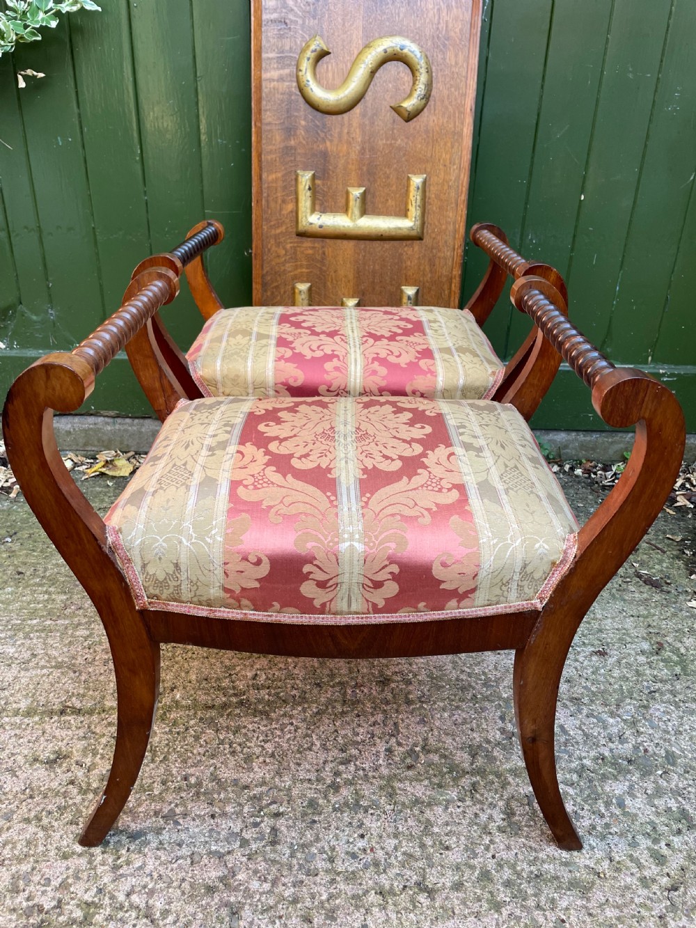 Set of four early nineteenth-century mahogany dressing stools with raised spiral-turned handles, swept legs, and red and gold patterned damask seats. View XIII