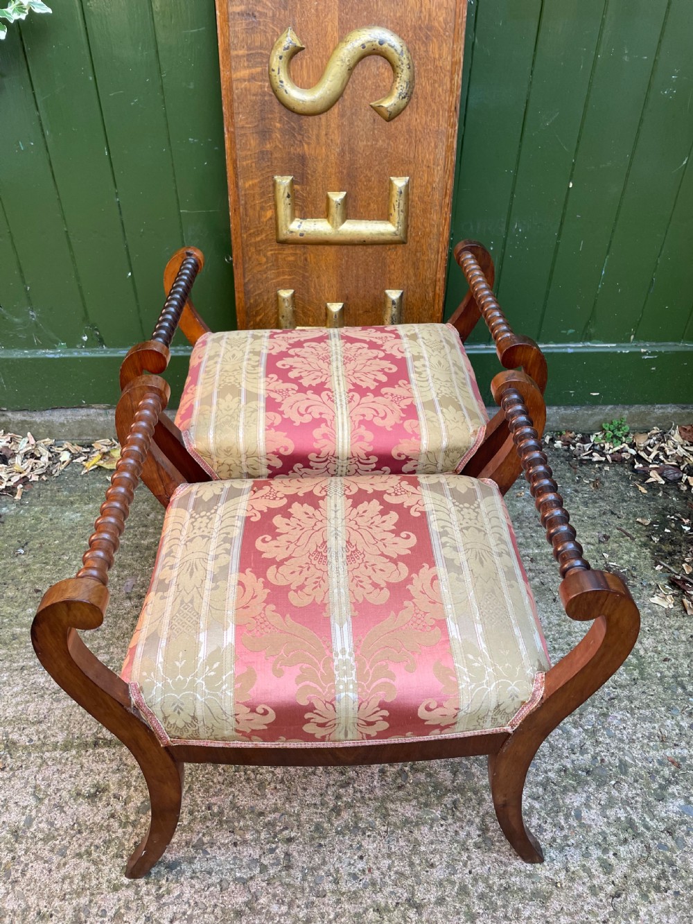 Set of four early nineteenth-century mahogany dressing stools with raised spiral-turned handles, swept legs, and red and gold patterned damask seats. View XIV