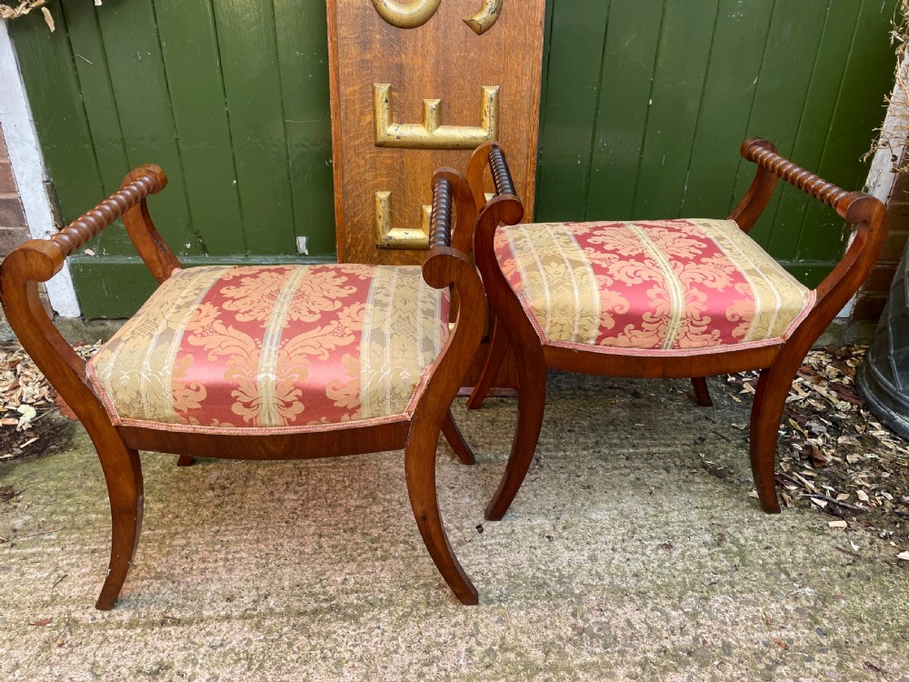 Set of four early nineteenth-century mahogany dressing stools with raised spiral-turned handles, swept legs, and red and gold patterned damask seats. View XV