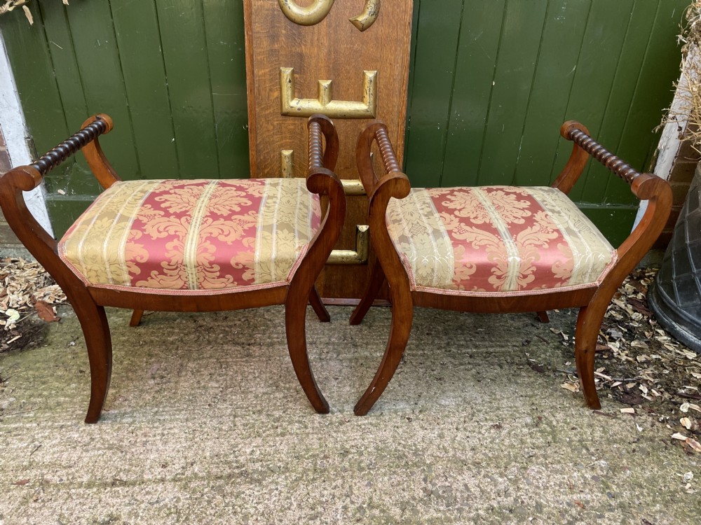 Set of four early nineteenth-century mahogany dressing stools with raised spiral-turned handles, swept legs, and red and gold patterned damask seats. View XVII