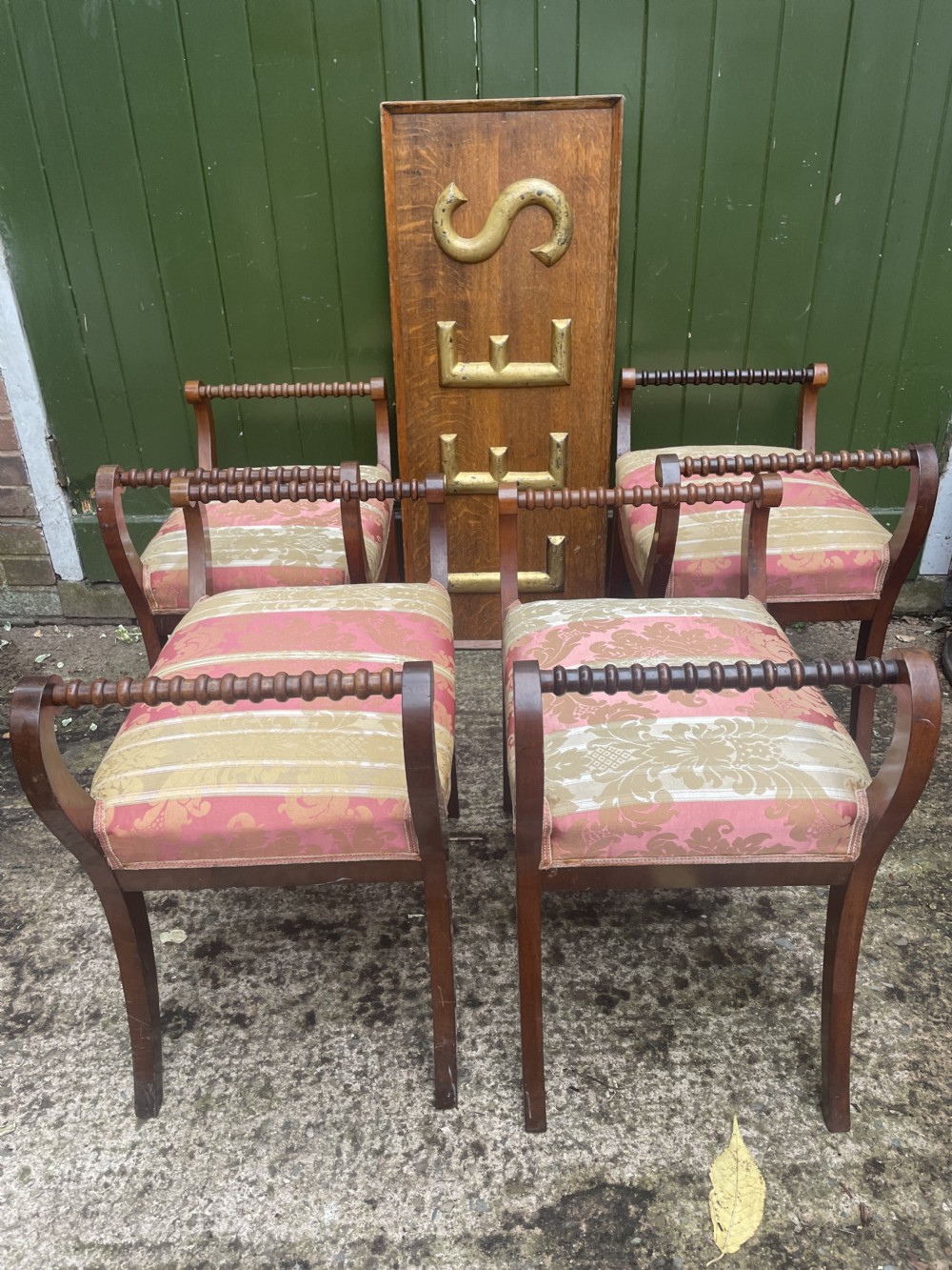 Set of four early nineteenth-century mahogany dressing stools with raised spiral-turned handles, swept legs, and red and gold patterned damask seats. View X