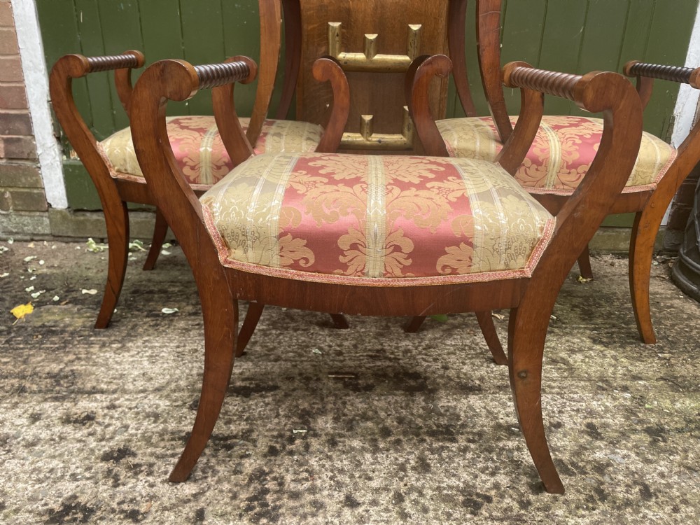 Set of four early nineteenth-century mahogany dressing stools with raised spiral-turned handles, swept legs, and red and gold patterned damask seats. View XXIII