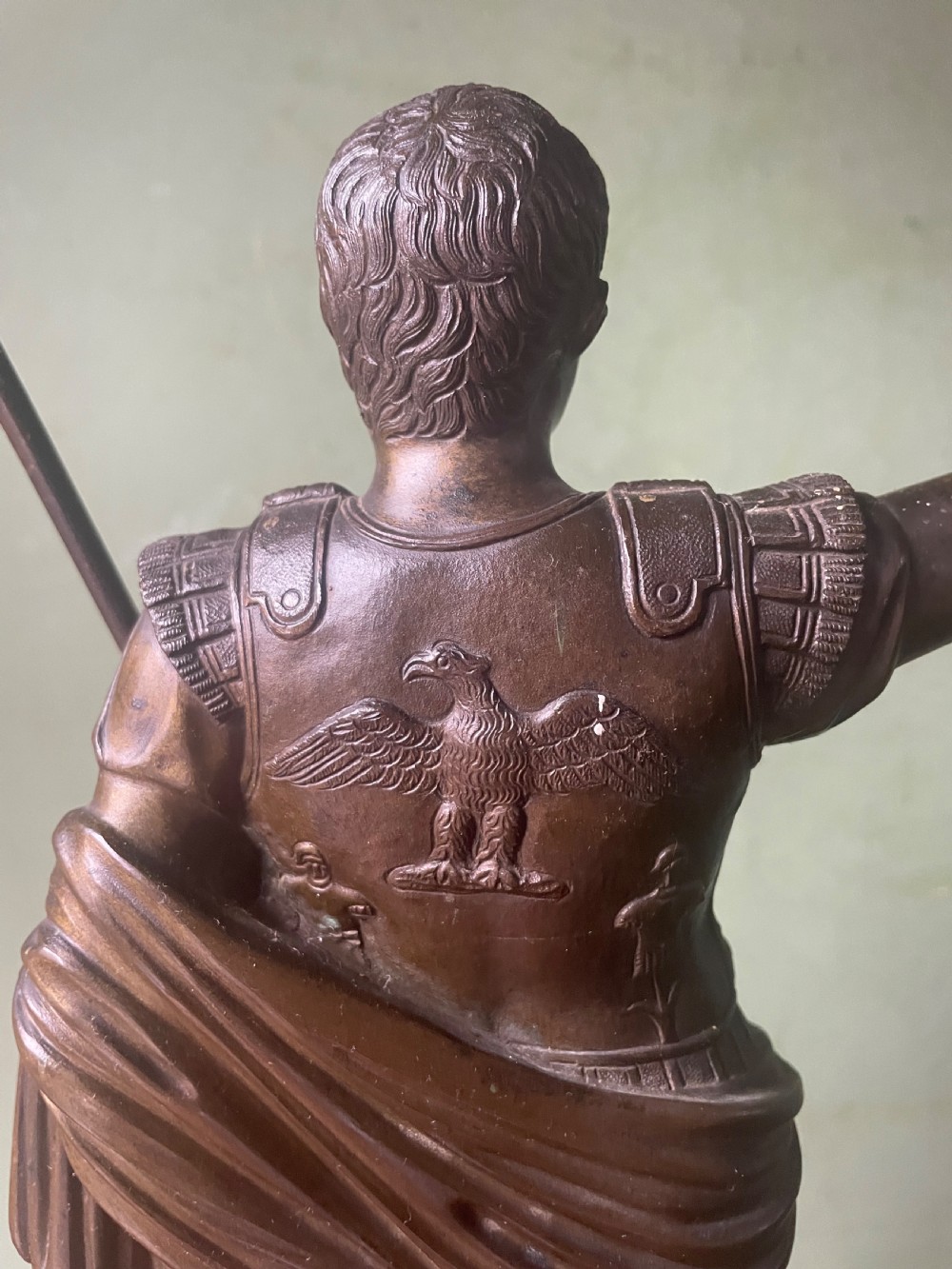 A late nineteenth-century dark bronze sculpture depicting Emperor Augustus of Prima Porta standing in classical armor with his right arm raised. View VIII