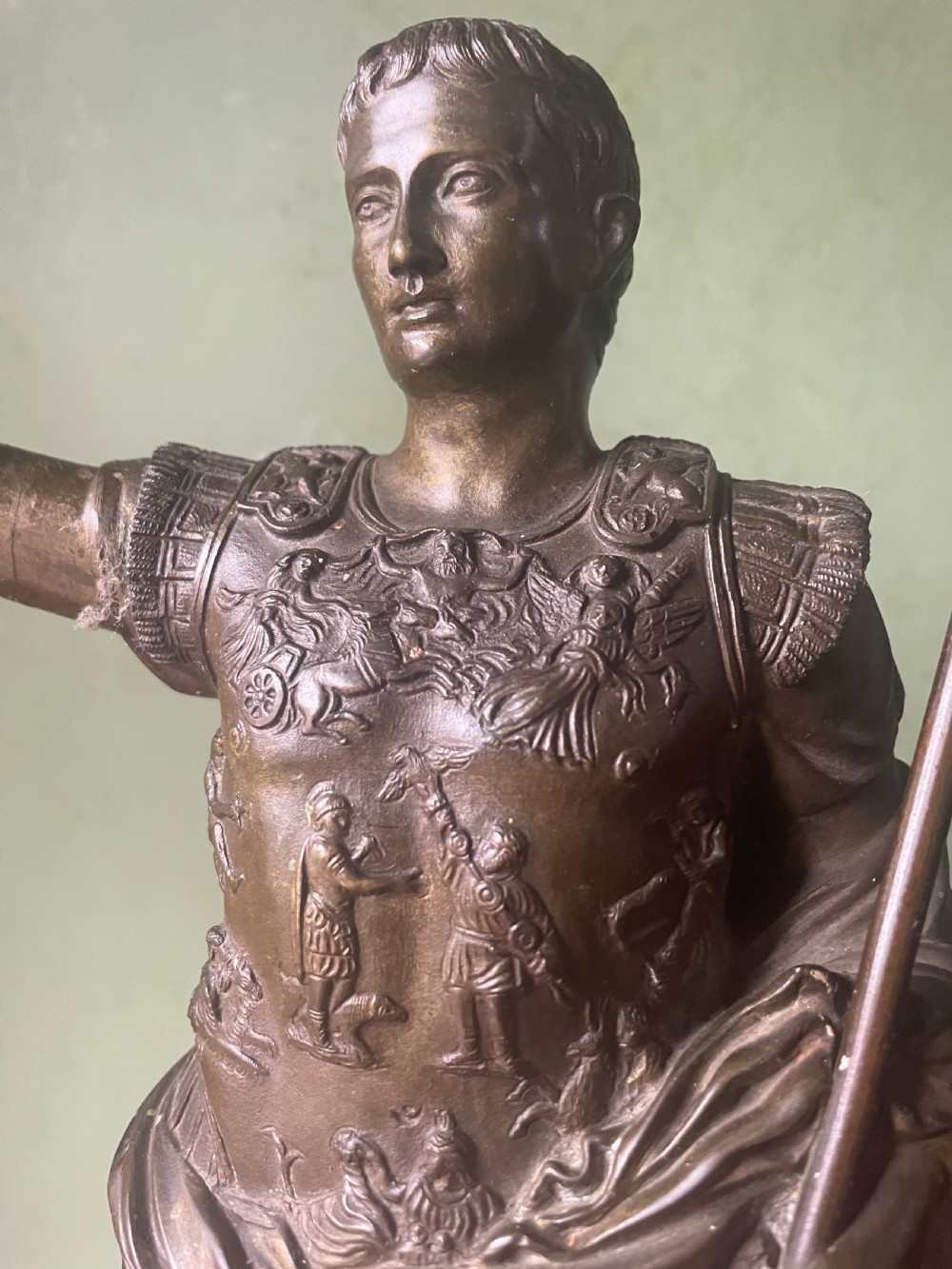 A late nineteenth-century dark bronze sculpture depicting Emperor Augustus of Prima Porta standing in classical armor with his right arm raised. View IX