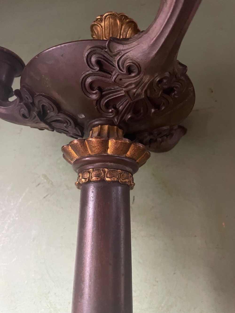 A pair of early nineteenth-century French Restauration patinated bronze and ormolu candelabras with serpent-entwined columns and scroll bases. View VII