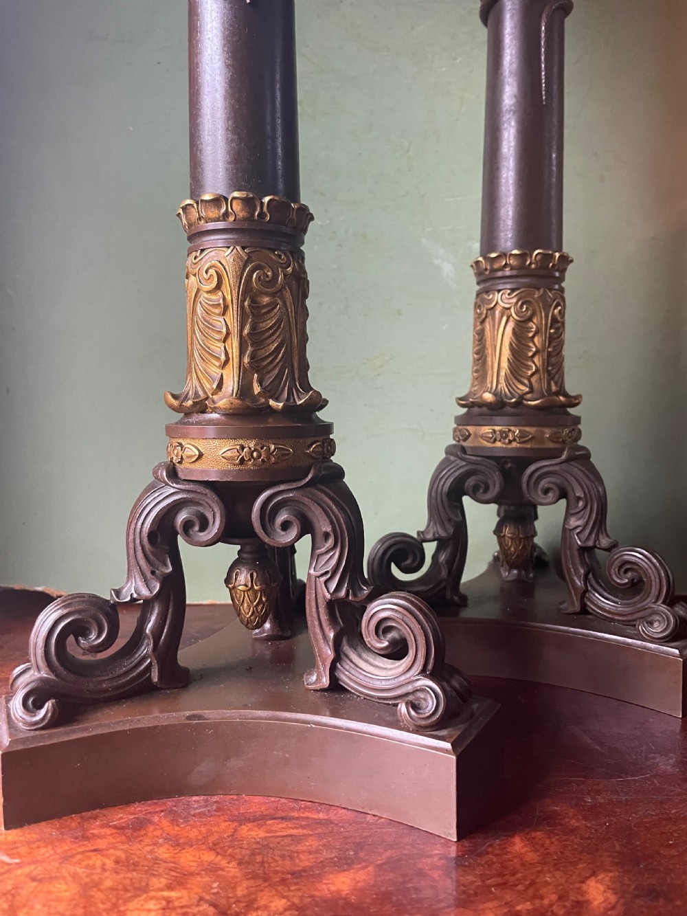 A pair of early nineteenth-century French Restauration patinated bronze and ormolu candelabras with serpent-entwined columns and scroll bases. View VIII