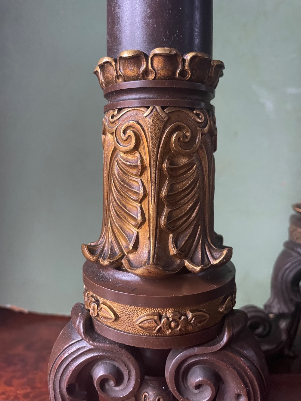 A pair of early nineteenth-century French Restauration patinated bronze and ormolu candelabras with serpent-entwined columns and scroll bases. View IX