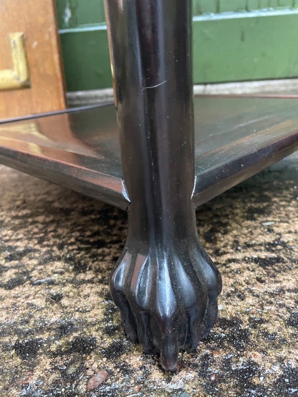 A late nineteenth-century Chinese square dark hardwood two-tier side table featuring intricately carved floral openwork aprons and lower shelf tiers. View IX