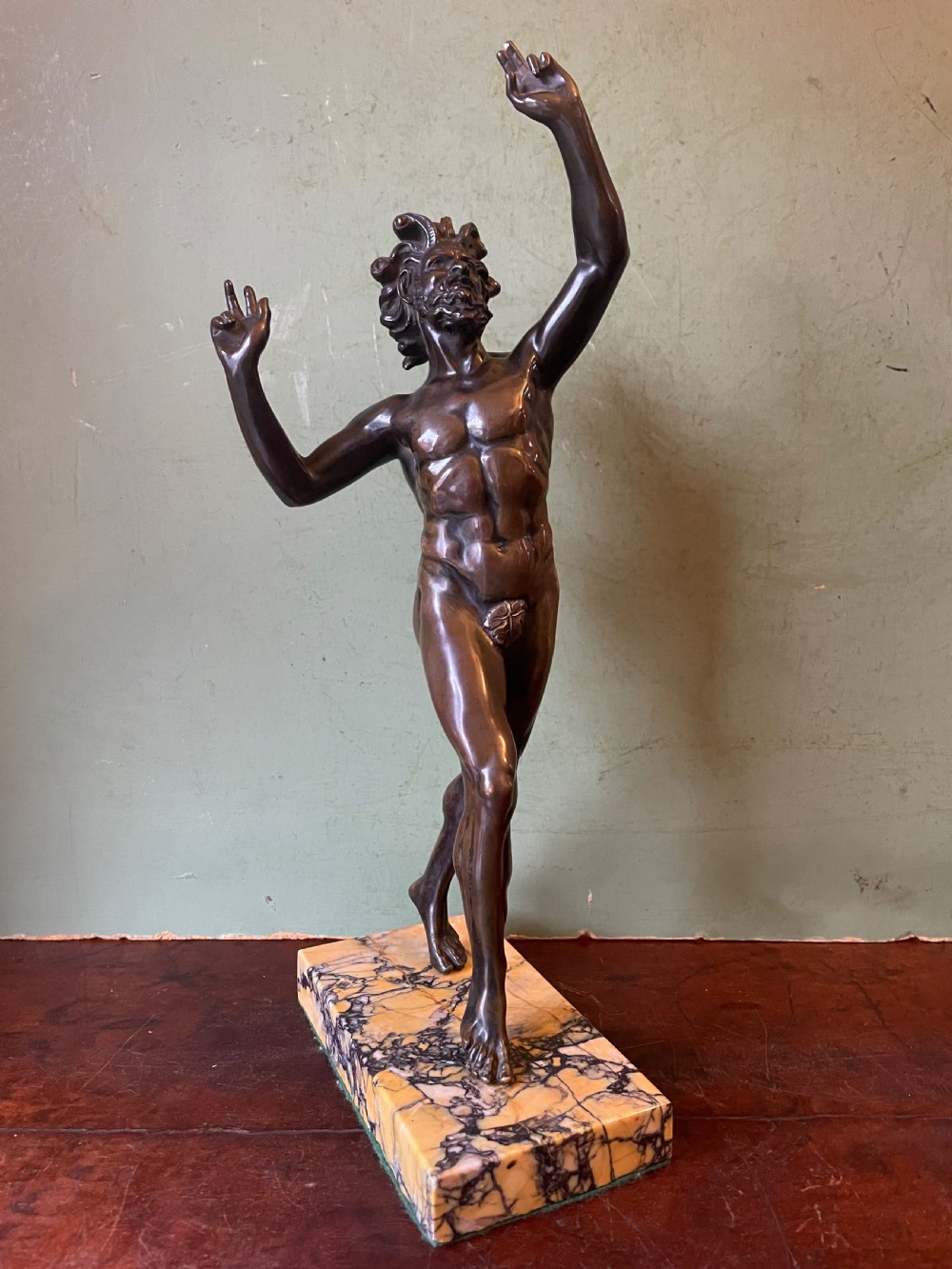 Early C19th Italian ‘Grand Tour’ souvenir bronze reduction, after the antique, of  “The Dancing Faun of Pompeii” .