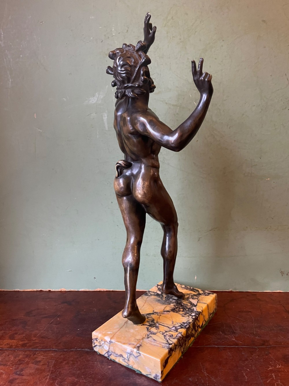 Early C19th Italian ‘Grand Tour’ souvenir bronze reduction, after the antique, of  “The Dancing Faun of Pompeii” . View IV
