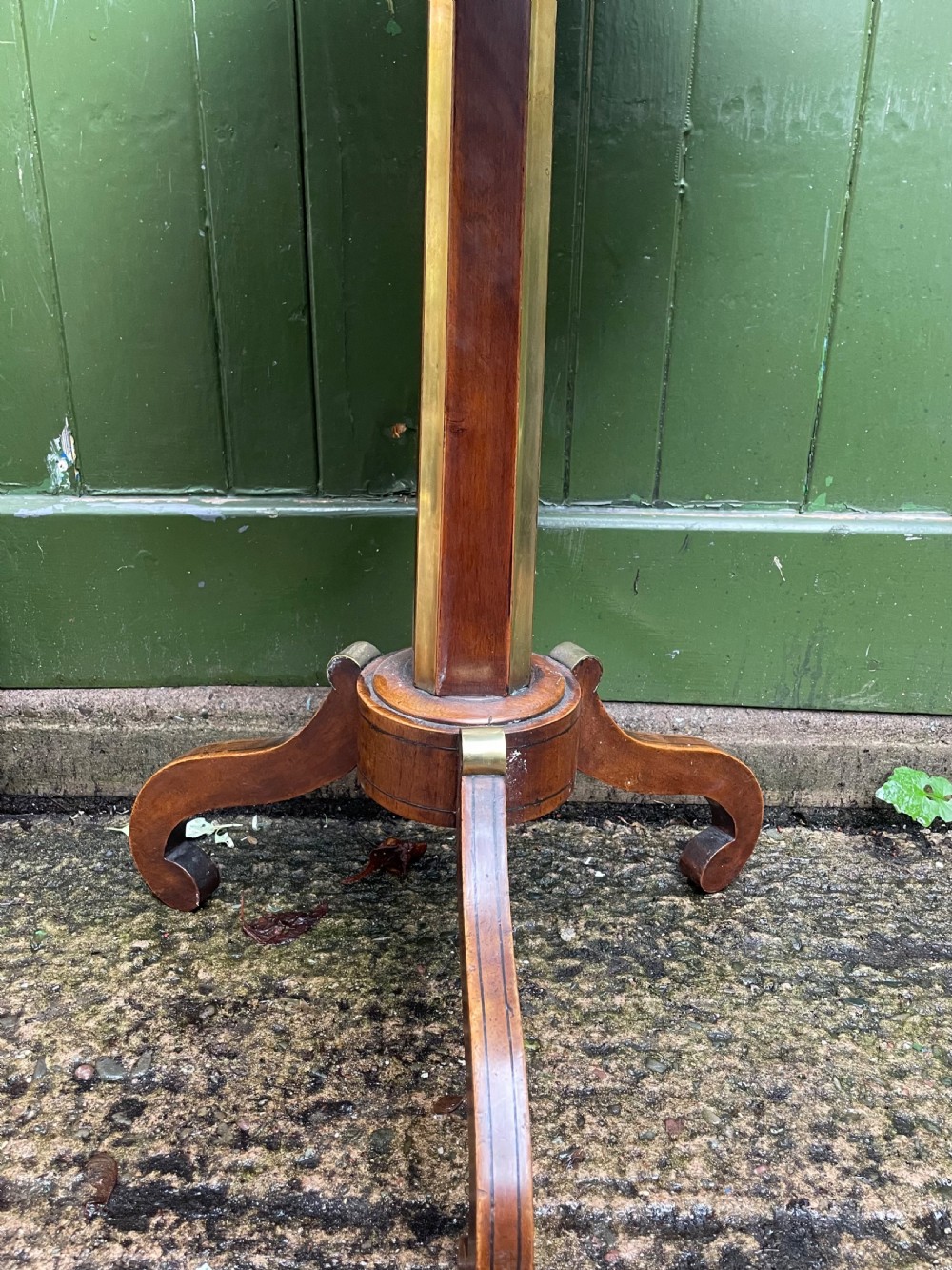 An early nineteenth-century Regency octagonal rosewood games table with a chequerboard inlaid top, brass mounts, and a tripod base. View XII