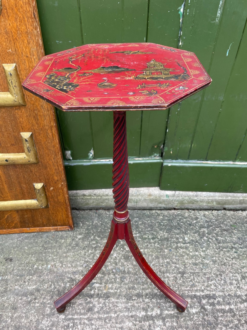Late 19th / early C20th Chinoiserie decorated vermilion red lacquer tripod table or candlestand in the late C18th George III period style.