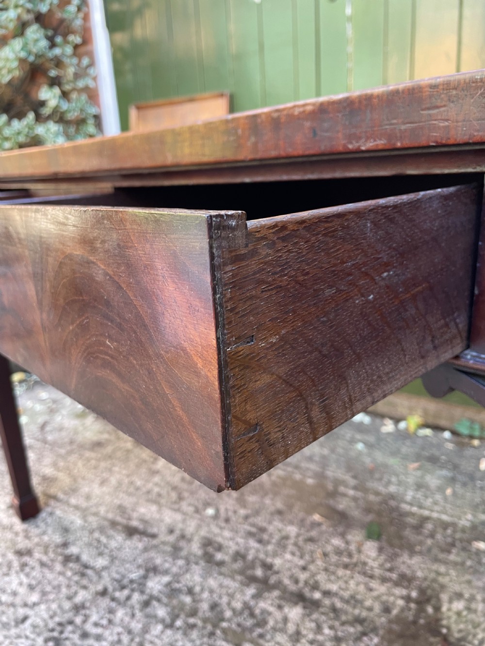 A late 18th-century George III mahogany pier table featuring fluted legs, carved corner brackets, and a rectangular polished top. View VIII
