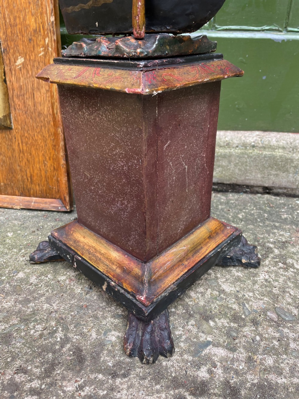 A late 19th-century Italian Venetian carved wood polychrome figure of a gondolier standing on a boat base atop a plinth, holding an oar and raised tray. View IX