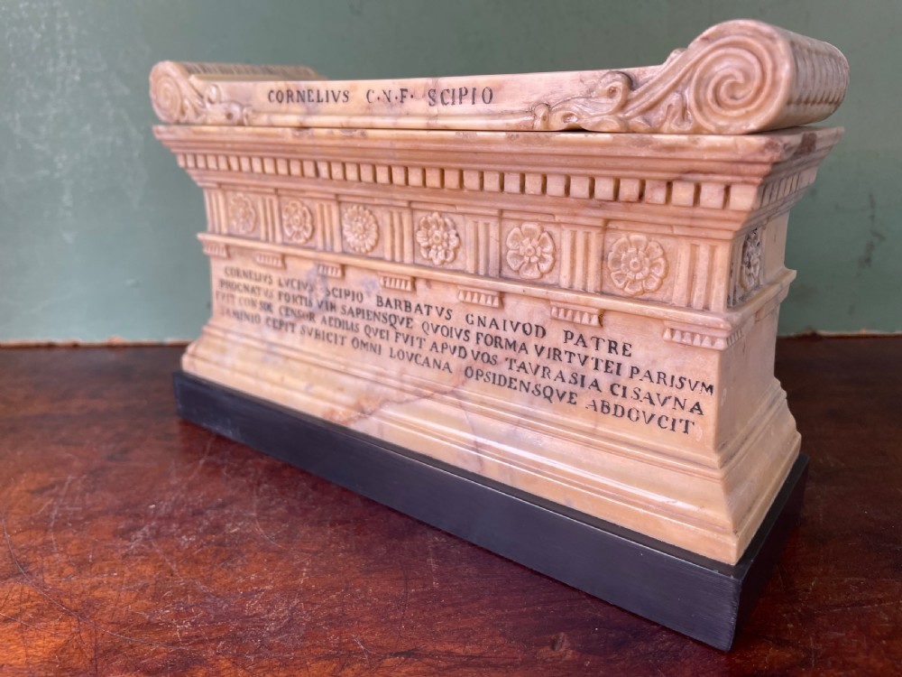Fine early C19th Italian ‘Grand Tour’ souvenir carved giallo antico marble reduction of the sarcophagus of Lucius Cornelius Scipio Barbatus. View II