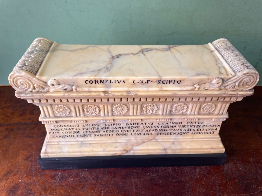 Fine early C19th Italian ‘Grand Tour’ souvenir carved giallo antico marble reduction of the sarcophagus of Lucius Cornelius Scipio Barbatus. View X