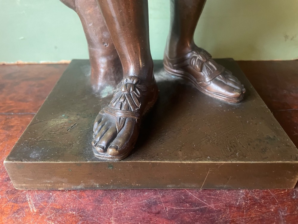 A 19th-century dark bronze sculpture depicting the classical figure of Diane de Gabii adjusting her draped robe. View XII