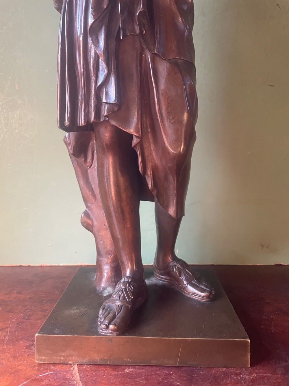 A 19th-century dark bronze sculpture depicting the classical figure of Diane de Gabii adjusting her draped robe. View XIV