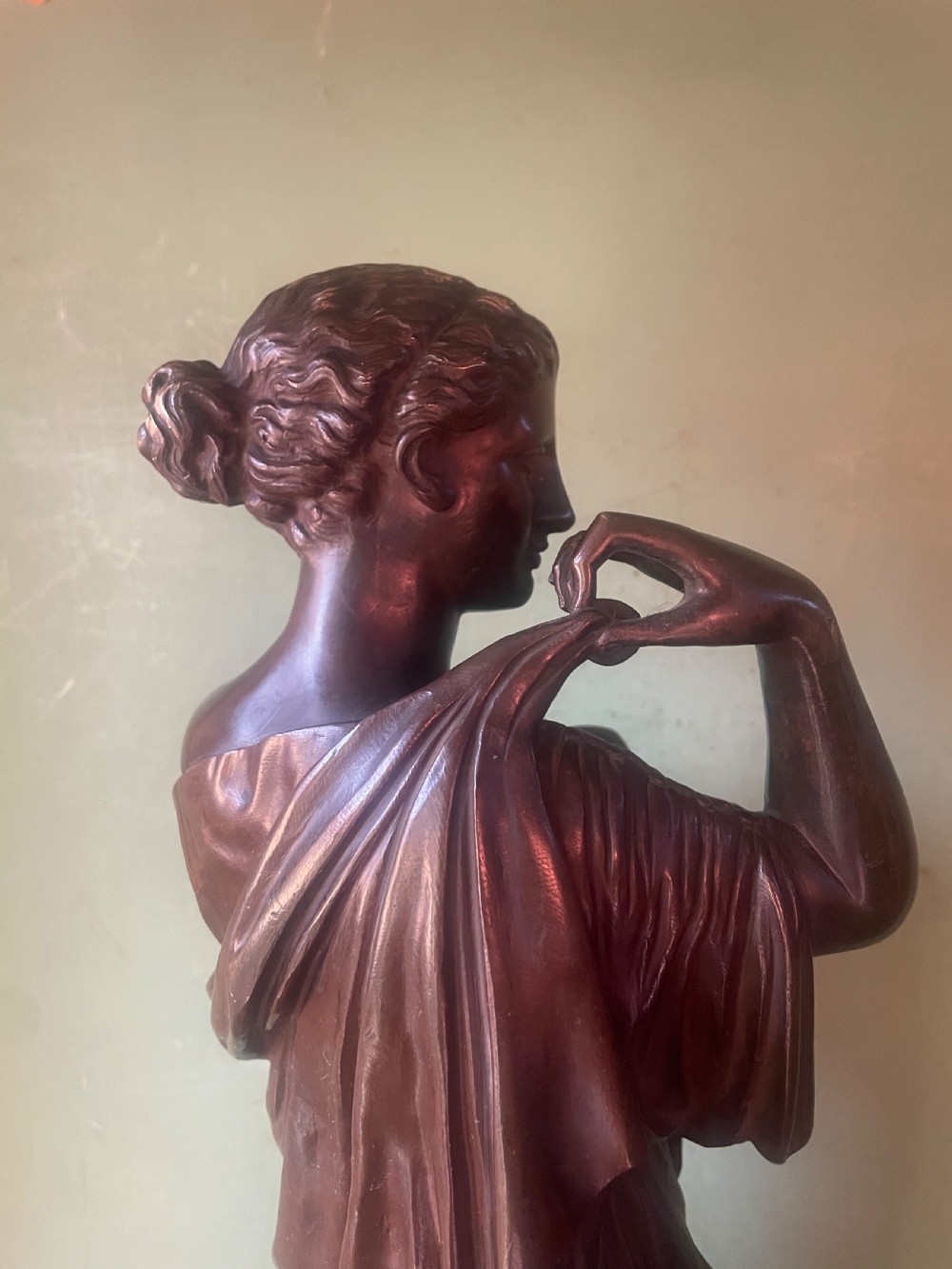 A 19th-century dark bronze sculpture depicting the classical figure of Diane de Gabii adjusting her draped robe. View XVI