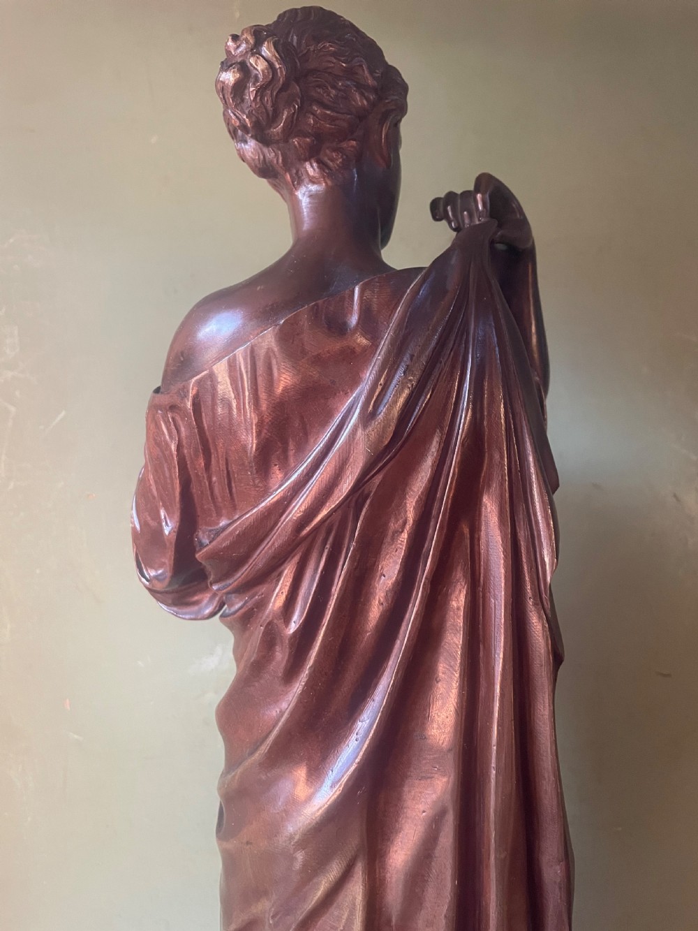 A 19th-century dark bronze sculpture depicting the classical figure of Diane de Gabii adjusting her draped robe. View XVII