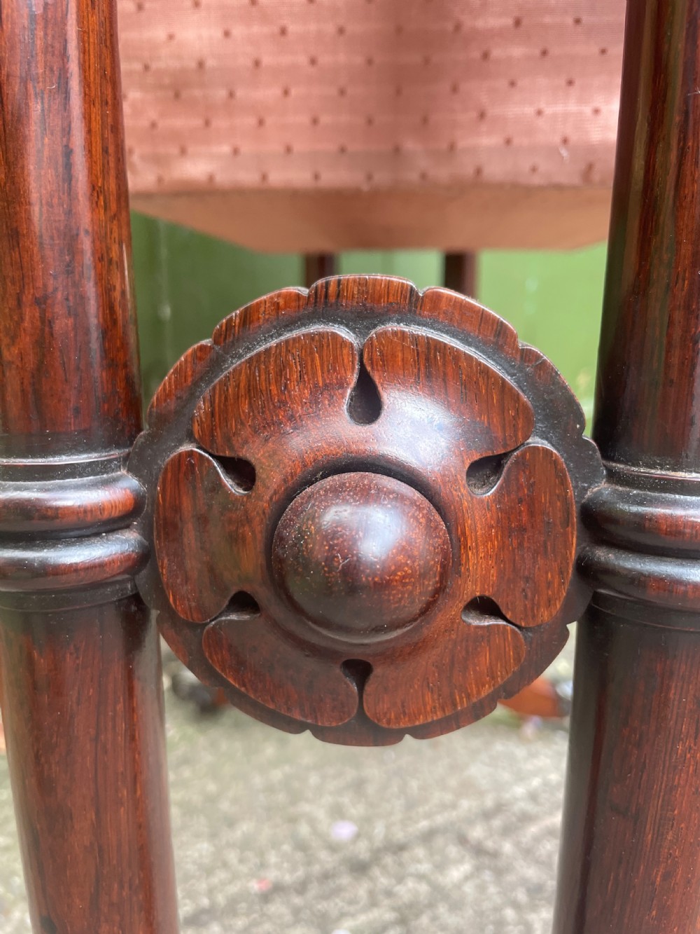 An early 19th-century George IV figured rosewood work table featuring a smooth polished top, single drawer, fabric work basket, turned twin-column supports, and brass castors. View XXV