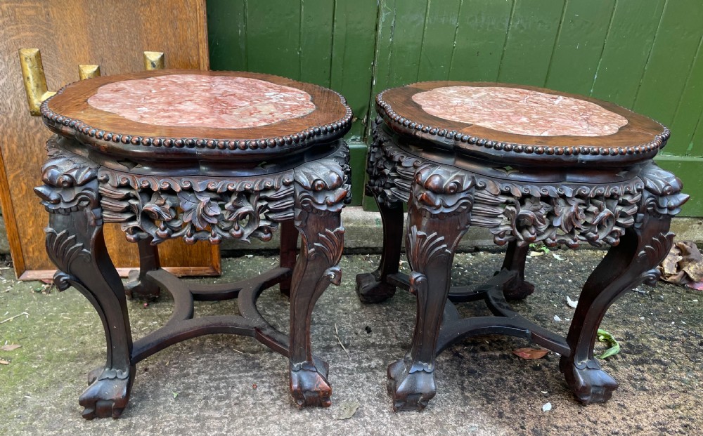 Pair of late C19th Chinese Qing Dynasty carved hardwood inset marble -top low tables or jardiniere stands .