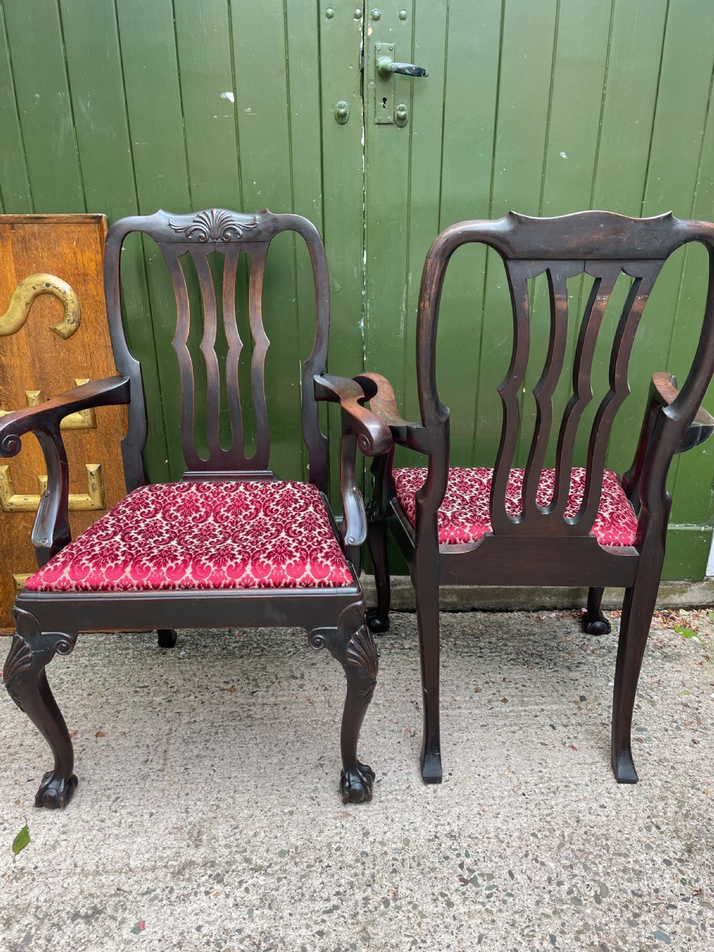 A pair of 19th-century mahogany open armchairs featuring carved shell cresting, pierced vertical splats, patterned red velvet seats, and cabriole legs with claw and ball feet. View XI