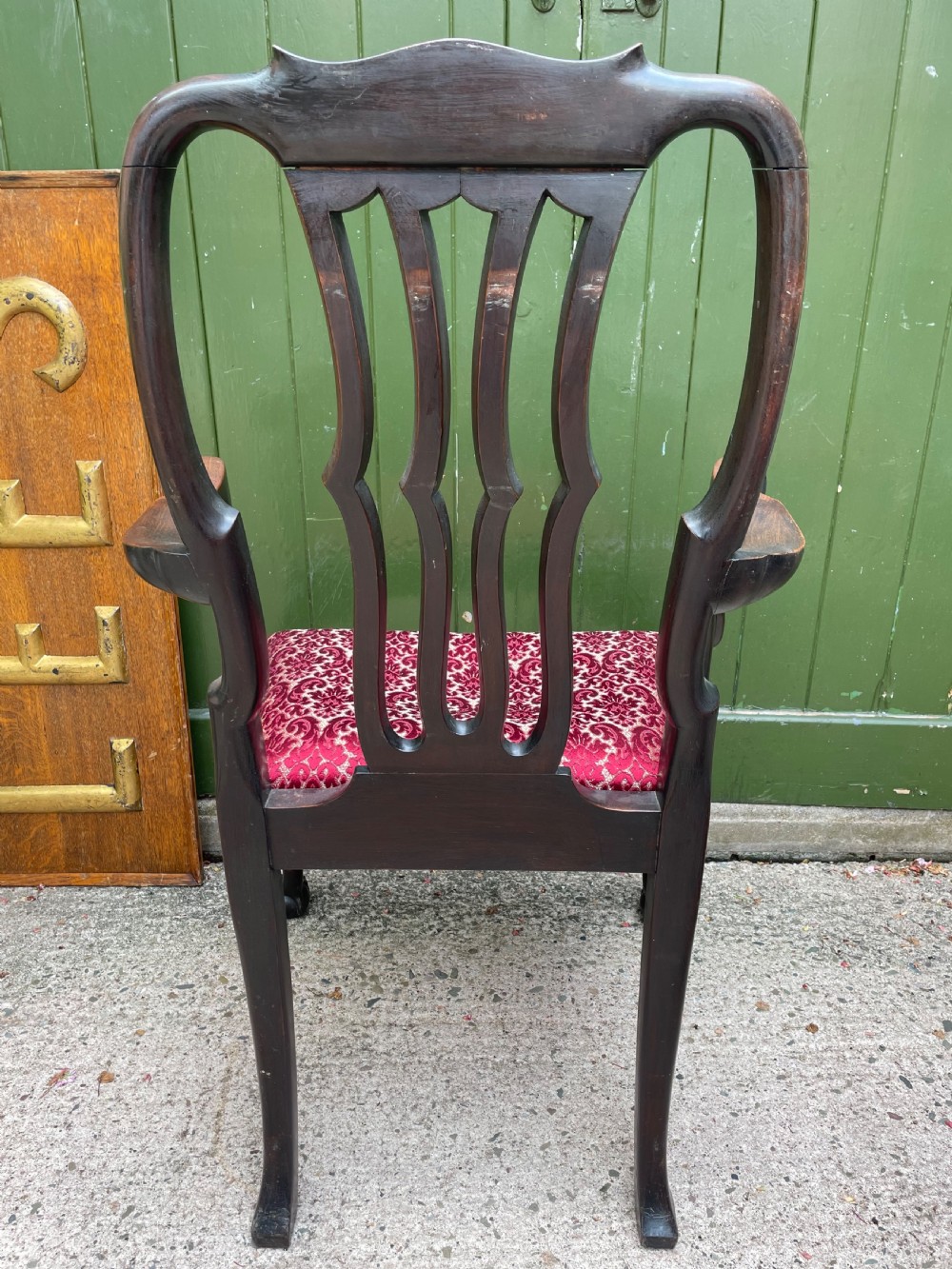 A pair of 19th-century mahogany open armchairs featuring carved shell cresting, pierced vertical splats, patterned red velvet seats, and cabriole legs with claw and ball feet. View XVII