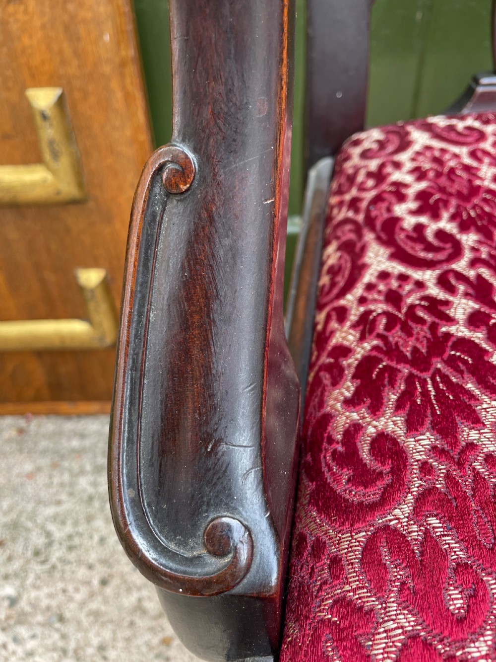 A pair of 19th-century mahogany open armchairs featuring carved shell cresting, pierced vertical splats, patterned red velvet seats, and cabriole legs with claw and ball feet. View XIX
