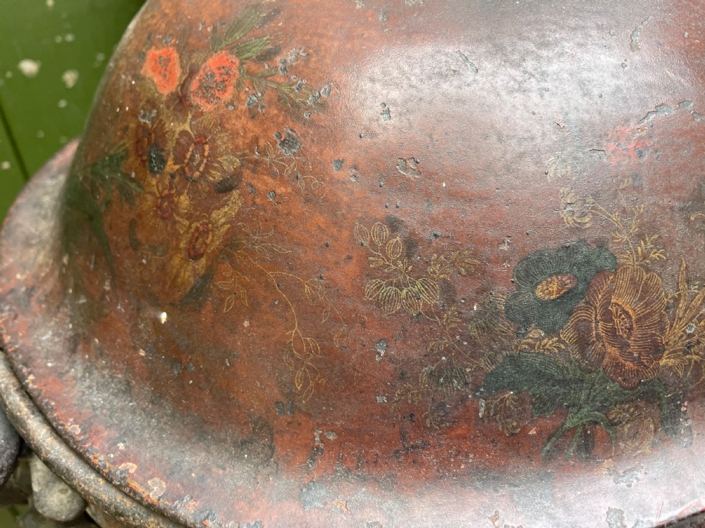 An early nineteenth-century round japanned tinware wine cooler with a domed lid, pedestal base, twin loop handles, and faded painted floral motifs. View XIV