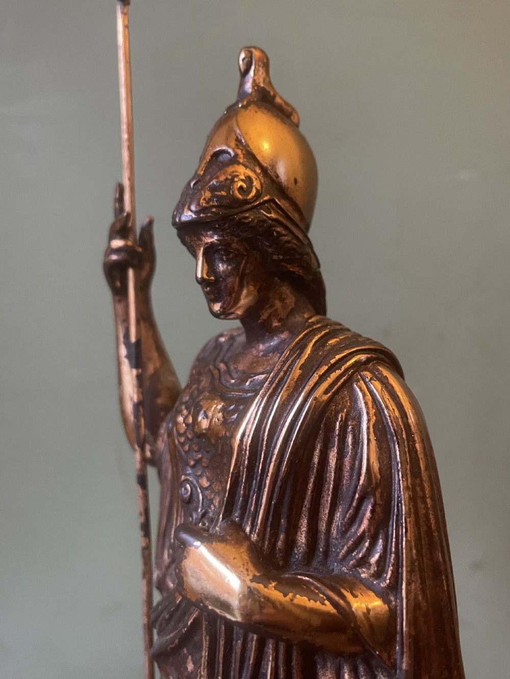 A nineteenth-century gilded bronze sculpture depicting the classical goddess Athena holding a spear, standing on a dark marble base. View XXI