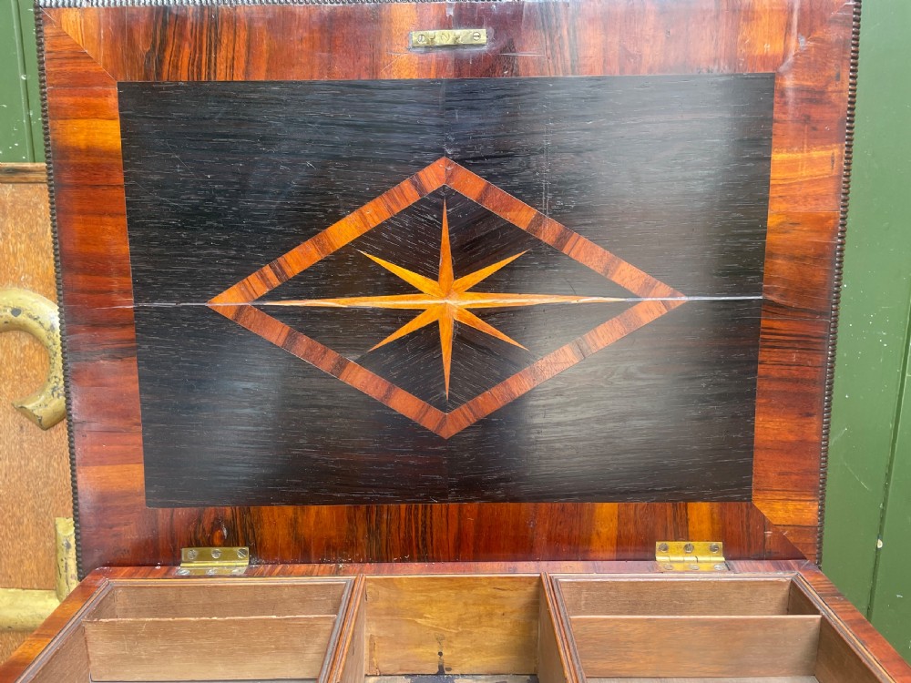 An early nineteenth-century George IV rosewood work table featuring a star-inlaid top, a single drawer casing, a tapered reeded column, and a tripartite base supported by carved claw feet. View IX
