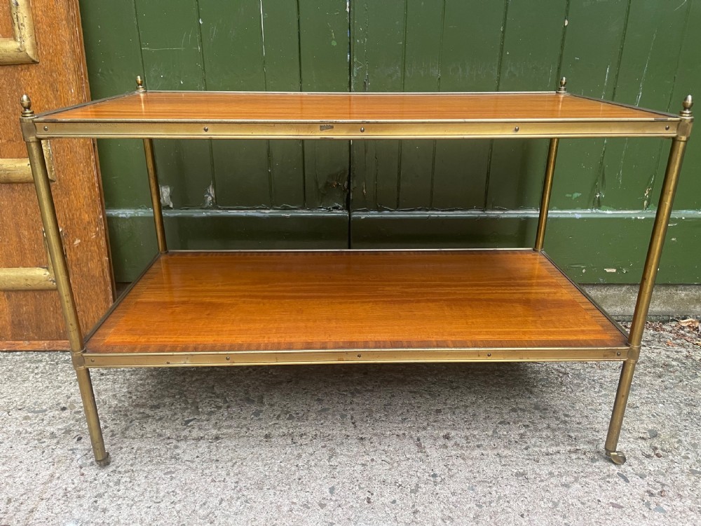 A low rectangular two-tier etagere table featuring satinwood shelves with decorative crossbanded inlay and a brass frame on castors. View XIII