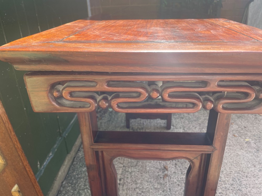 A late nineteenth-century Chinese carved hardwood altar table with an openwork apron and straight legs. View III