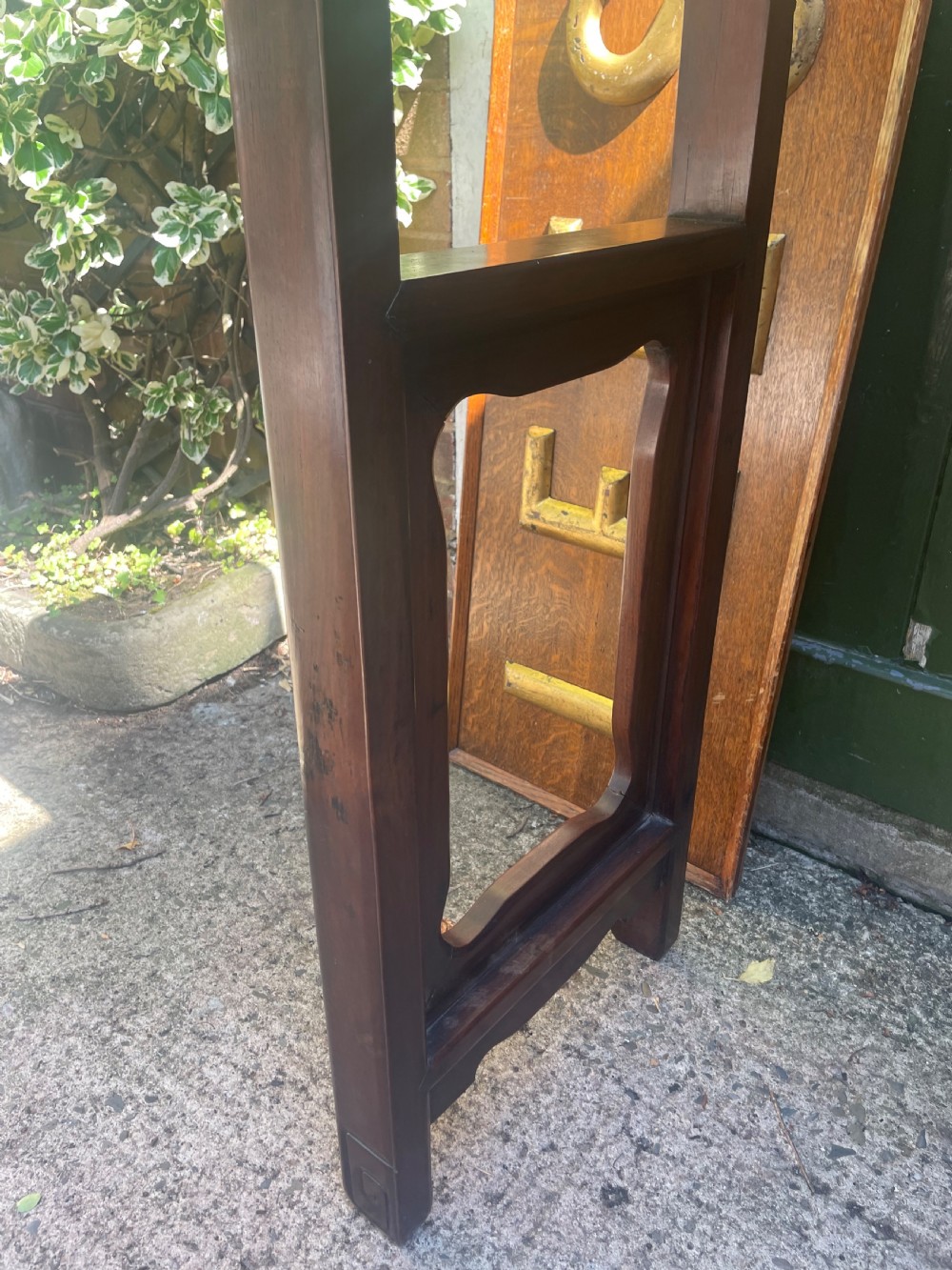 A late nineteenth-century Chinese carved hardwood altar table with an openwork apron and straight legs. View XII