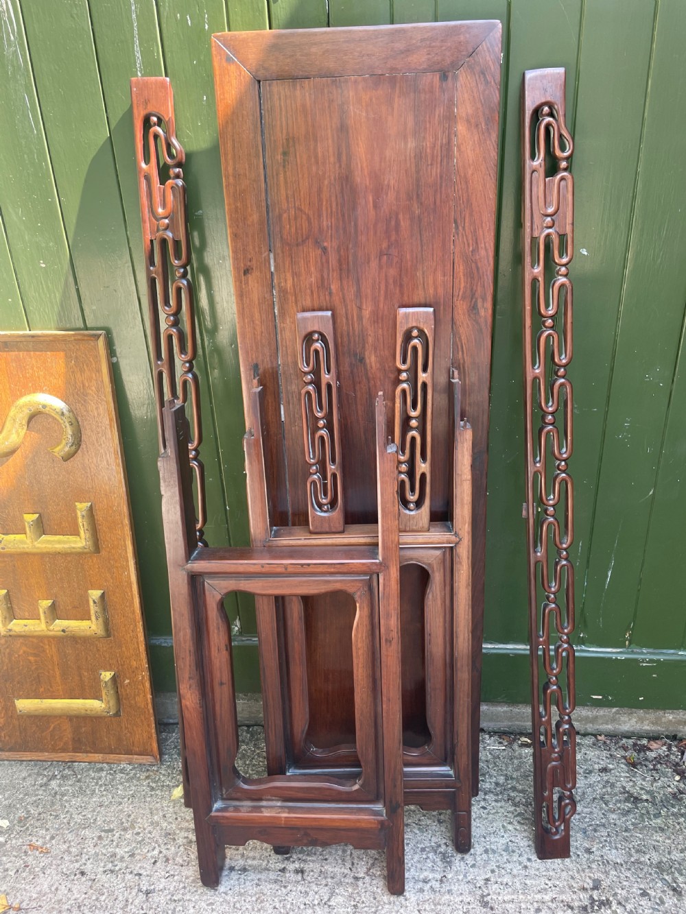 A late nineteenth-century Chinese carved hardwood altar table with an openwork apron and straight legs. View XXIII