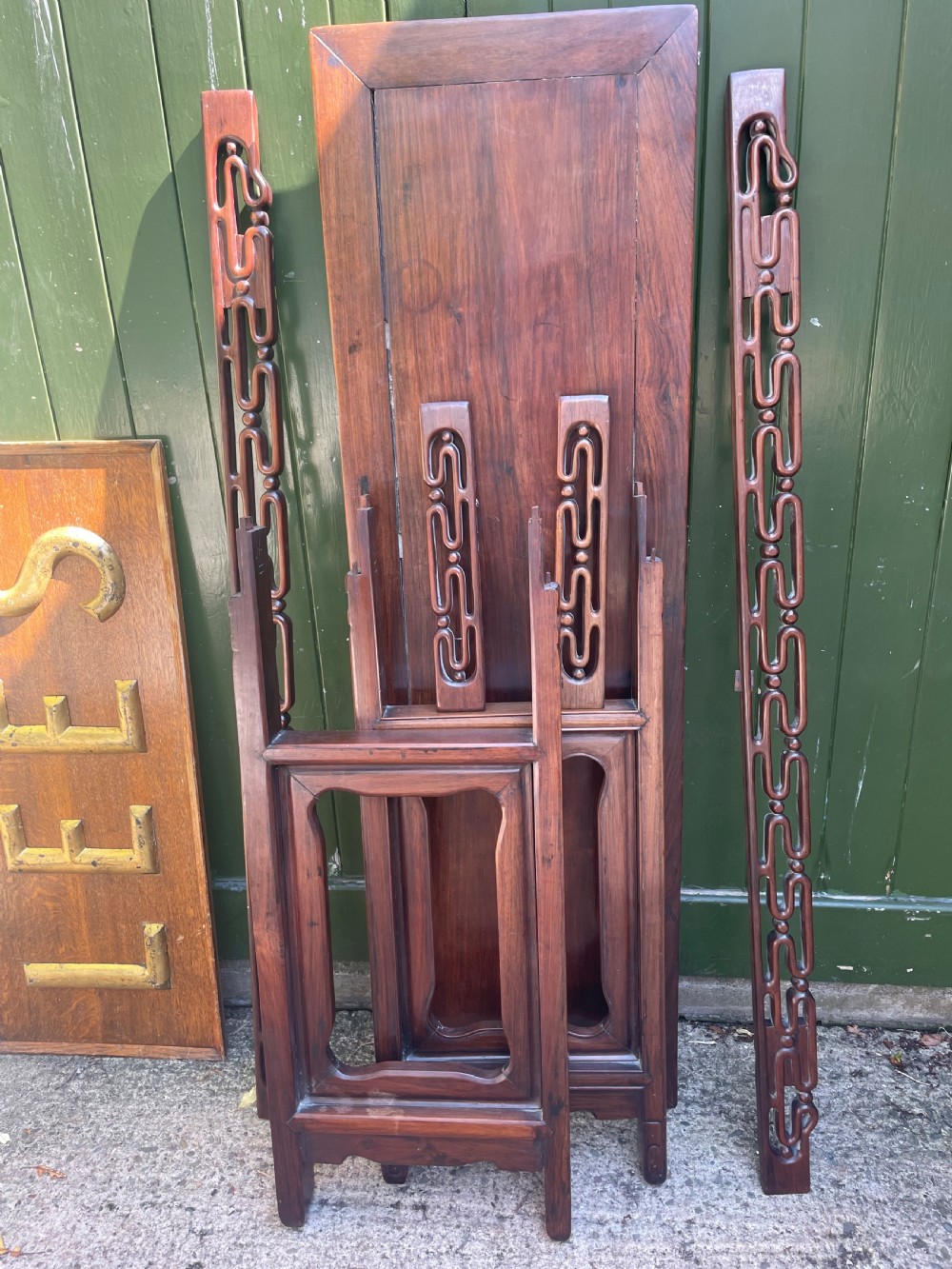 A late nineteenth-century Chinese carved hardwood altar table with an openwork apron and straight legs. View XXV