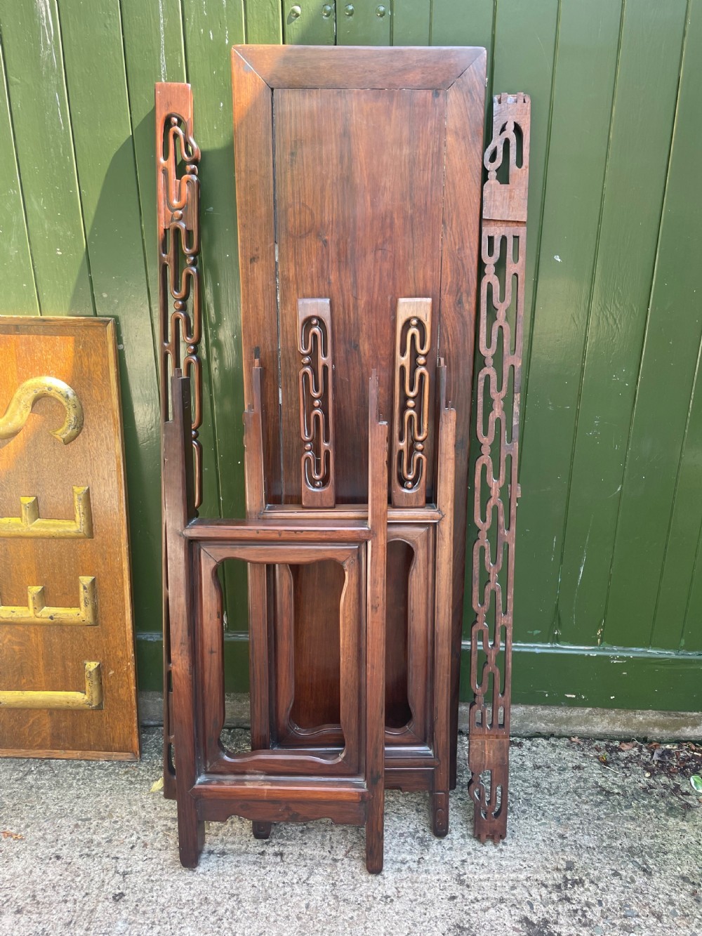 A late nineteenth-century Chinese carved hardwood altar table with an openwork apron and straight legs. View XXVII