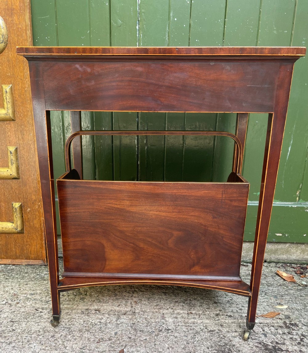 A late 18th-century George III Sheraton mahogany cheveret writing desk featuring a removable upper drawer section with an arched handle, line inlay, and tapered square legs on castors. View VIII