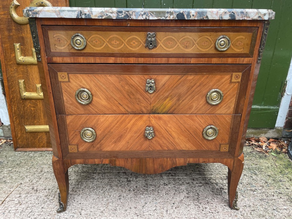 Late C19th French walnut , satinwood , rosewood , tulipwood and kingwood marble-topped commode of Louis XVI period transitional design .