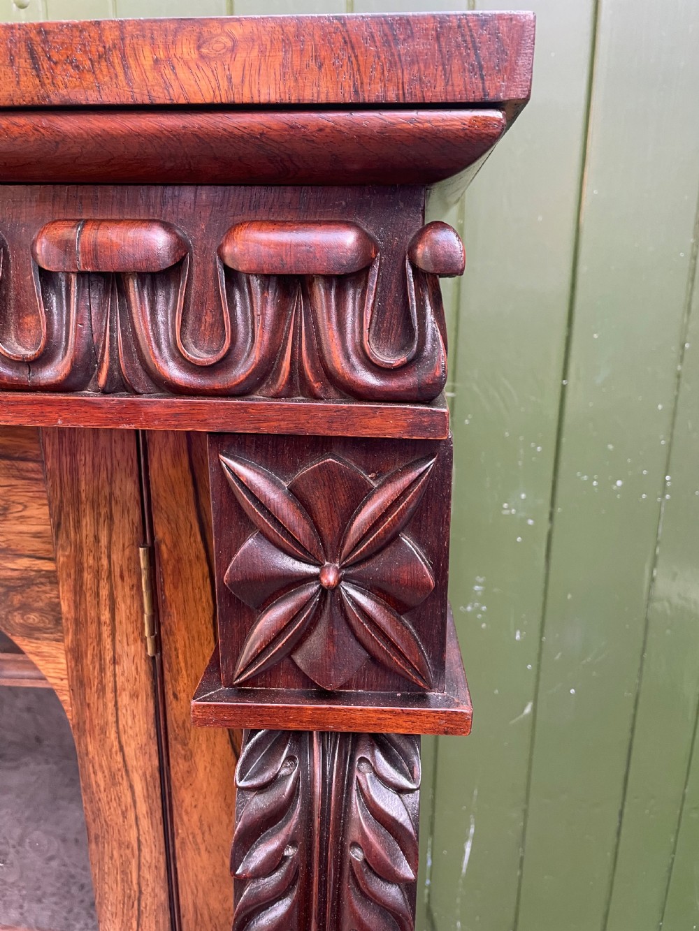 Early C19th George IV period carved rosewood glazed bookcase or pier cabinet of bold design .  View VI