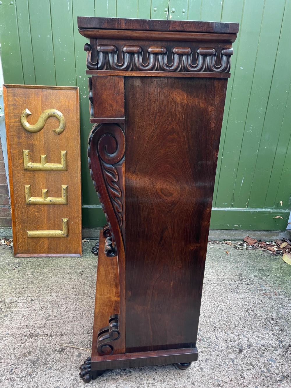 Early C19th George IV period carved rosewood glazed bookcase or pier cabinet of bold design .  View XVII